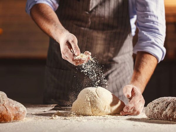 Brot Backen, Teig und Mehl. Hands of the baker's male knead dough, © Evgeny Atamanenko, # 101297262 123rf.com.